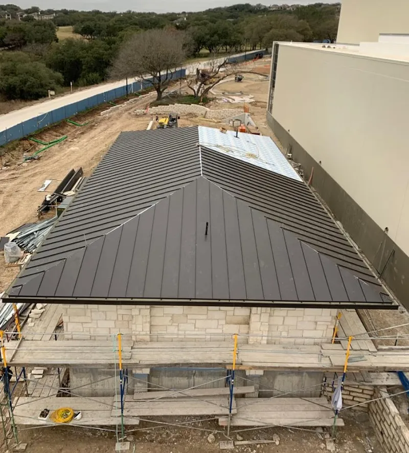 Metal roof new construction with scaffolding in Newport